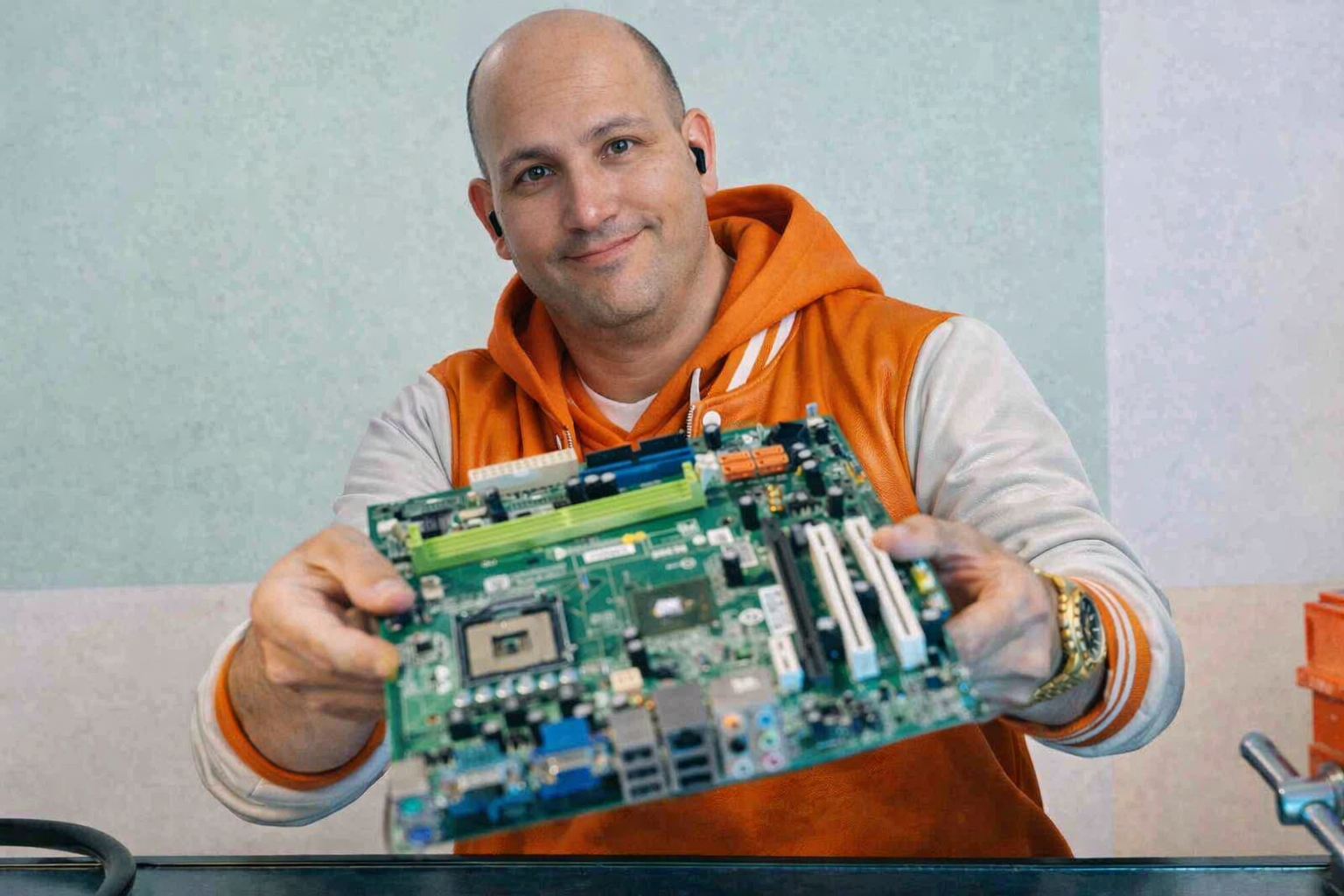 Technician showing a motherboard